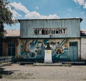 An old Agitpunkt with a statue of Lenin in a village on Issyk-Kul, Kyrgyzstan.