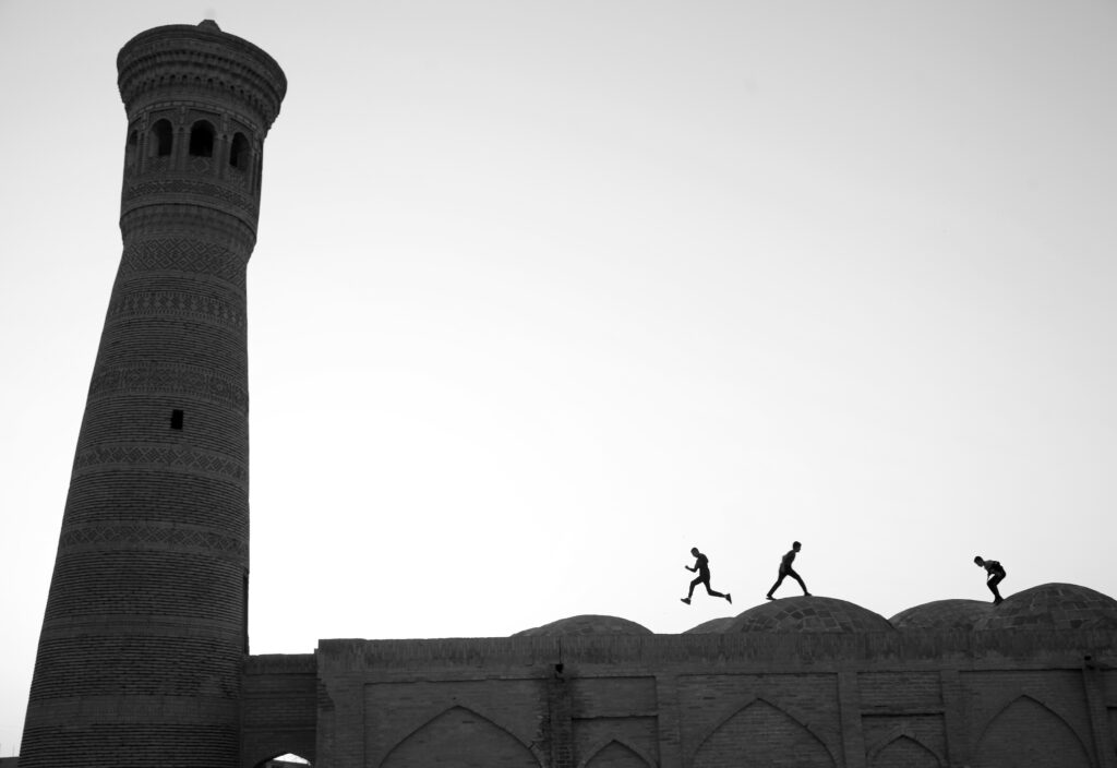 Kids playing on the roofs of Bukharian monuments